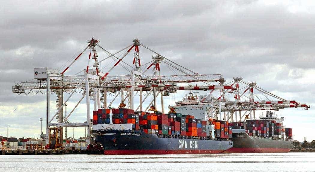 Container cranes and stacked shipping containers at the Port of Melbourne